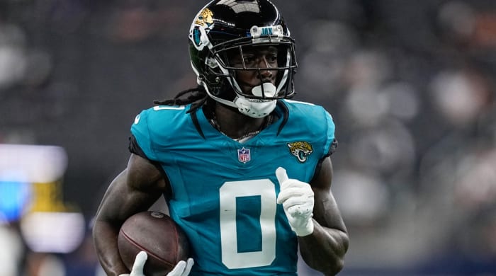 Jacksonville Jaguars wide receiver Calvin Ridley (0) runs drills before an NFL preseason football game against the Dallas Cowboys, Saturday, Aug. 12, 2023, in Arlington, Texas. (AP Photo/Tony Gutierrez)